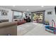 Living room area featuring a red leather couch and a sliding glass door leading to the patio at 302 Hermits Trl, Altamonte Springs, FL 32701