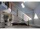 Bright, neutral staircase with sleek railings and hardwood floors near a kitchen area at 302 Hermits Trl, Altamonte Springs, FL 32701