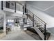 Modern staircase with black metal railings and wood treads, leading to second level at 302 Hermits Trl, Altamonte Springs, FL 32701