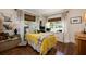 Inviting bedroom featuring two large windows and hardwood floors; perfect for rest and relaxation at 306 Albany Ave, Deland, FL 32724