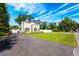 Charming home with landscaped front yard, a driveway, and white privacy fence at 306 Albany Ave, Deland, FL 32724
