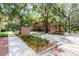 Street view featuring the Stetson University sign, lush greenery, and brick buildings at 306 Albany Ave, Deland, FL 32724