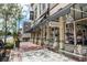 A commercial street view with retail shops, shade awnings, and benches at 306 Albany Ave, Deland, FL 32724