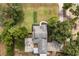 Overhead view of a home featuring an outdoor firepit area and lush green surroundings at 32615 Windy Oak St, Sorrento, FL 32776