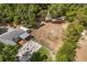 Overhead shot highlighting an outdoor firepit area and generous yard at 32615 Windy Oak St, Sorrento, FL 32776