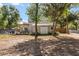Expansive backyard with a pergola, patio furniture, shed and plenty of shade at 32615 Windy Oak St, Sorrento, FL 32776