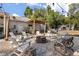 Picturesque backyard featuring a fire pit with seating, a wooden deck, and mature trees for privacy at 32615 Windy Oak St, Sorrento, FL 32776