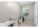 Bedroom with neutral carpet, window, storage and an AC unit for climate control at 32615 Windy Oak St, Sorrento, FL 32776