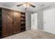 Bedroom with carpet and built-in shelves at 32615 Windy Oak St, Sorrento, FL 32776