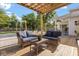 Relaxing covered deck with comfortable seating, perfect for enjoying the outdoors in style at 32615 Windy Oak St, Sorrento, FL 32776