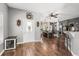 Inviting entryway with wood-look tile flooring, farmhouse accents, and natural light at 32615 Windy Oak St, Sorrento, FL 32776