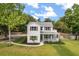 Charming two-story home with a welcoming front porch and well-manicured lawn, perfect for enjoying outdoor living at 32615 Windy Oak St, Sorrento, FL 32776