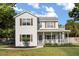 Attractive two-story home with a covered front porch, perfect for enjoying outdoor moments at 32615 Windy Oak St, Sorrento, FL 32776