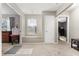 Hallway features neutral carpet, a window seat, and multiple doorways providing easy access at 32615 Windy Oak St, Sorrento, FL 32776