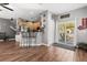 Bright kitchen area showcasing wooden cabinets, breakfast bar, and an adjoining dining space at 32615 Windy Oak St, Sorrento, FL 32776