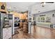 Bright kitchen with wood cabinets, stainless steel appliances, and charming farmhouse decor at 32615 Windy Oak St, Sorrento, FL 32776