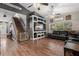 Stylish living room with staircase, built-in shelving, comfortable seating and lots of room at 32615 Windy Oak St, Sorrento, FL 32776