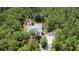 Aerial view of a home with a private pool and wooded surroundings at 3441 Hickory Creek Rd, Deltona, FL 32738