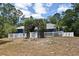 Backyard features grass, arbor gate with white fence surround the entire yard of the blue house at 3441 Hickory Creek Rd, Deltona, FL 32738