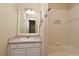A full bathroom offering a large mirror, vanity with storage, and shower-tub combo at 3441 Hickory Creek Rd, Deltona, FL 32738