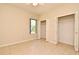 Bright bedroom boasts a window and double closets at 3441 Hickory Creek Rd, Deltona, FL 32738
