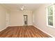 Bedroom with hardwood floors, large windows and a ceiling fan for added comfort at 3441 Hickory Creek Rd, Deltona, FL 32738