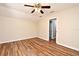 Bright bedroom with vaulted ceiling features wood floors and a view of the bathroom at 3441 Hickory Creek Rd, Deltona, FL 32738