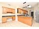Spacious kitchen with granite countertops, custom cabinets, and modern appliances at 3441 Hickory Creek Rd, Deltona, FL 32738