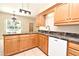 Kitchen area with granite countertops, stainless steel dishwasher, and plenty of cabinet space at 3441 Hickory Creek Rd, Deltona, FL 32738