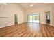 Bright living room featuring sliding glass doors to the pool area at 3441 Hickory Creek Rd, Deltona, FL 32738