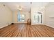 Spacious living room with hardwood-style floors and chandelier at 3441 Hickory Creek Rd, Deltona, FL 32738
