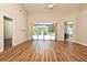 Living room view of pool through sliding glass door, with tile flooring at 3441 Hickory Creek Rd, Deltona, FL 32738