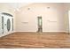 Open-plan living room with archways and hardwood-style floors at 3441 Hickory Creek Rd, Deltona, FL 32738