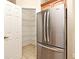 Walk-in pantry and stainless-steel refrigerator provides ample storage space at 3441 Hickory Creek Rd, Deltona, FL 32738