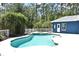 Beautiful backyard pool with an arbor and fence next to the back of the blue house at 3441 Hickory Creek Rd, Deltona, FL 32738
