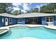 Backyard pool with house; covered patio features fans and bench seat, with views of pool, spa and patio at 3441 Hickory Creek Rd, Deltona, FL 32738