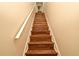 Stairway featuring hard surface steps and white railing at 3441 Hickory Creek Rd, Deltona, FL 32738