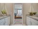 Elegant bathroom featuring dual sinks with granite countertops and a view into the cozy, carpeted bedroom at 3586 Dahlia Dr, Lake Hamilton, FL 33851