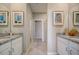 Bathroom featuring granite countertops, dual vanities and a tile shower at 3586 Dahlia Dr, Lake Hamilton, FL 33851