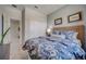 Bedroom featuring bed with patterned bedding, white sliding-door closet and gray walls at 3586 Dahlia Dr, Lake Hamilton, FL 33851