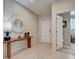 Bright foyer with tiled flooring, modern decor, and a view into the living area at 3586 Dahlia Dr, Lake Hamilton, FL 33851