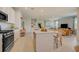 Beautiful open concept kitchen featuring a center island and seamless flow to the living area at 3586 Dahlia Dr, Lake Hamilton, FL 33851