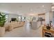 Open concept living room and kitchen featuring neutral tones and lots of natural light at 3586 Dahlia Dr, Lake Hamilton, FL 33851