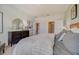 Relaxing bedroom featuring a decorative mirror, a large dresser and soft decor at 3586 Dahlia Dr, Lake Hamilton, FL 33851