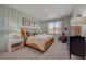 Stylish main bedroom featuring a cozy reading nook and lots of natural light at 3586 Dahlia Dr, Lake Hamilton, FL 33851