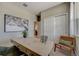 Well-lit office features a modern desk, neutral tones, a window, and stylish decor at 3586 Dahlia Dr, Lake Hamilton, FL 33851