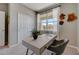 Bright office features a stylish desk, a neutral color palette, and a view of the outdoors at 3586 Dahlia Dr, Lake Hamilton, FL 33851