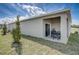 Covered patio with sliding glass door and outdoor seating, perfect for relaxation at 3586 Dahlia Dr, Lake Hamilton, FL 33851