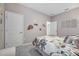 Bedroom featuring a floral comforter, plush gray carpet and decorative floral decals at 3588 Dahlia Dr, Haines City, FL 33844