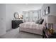 A modern bedroom features a queen-sized bed, dresser, and natural light at 3588 Dahlia Dr, Haines City, FL 33844